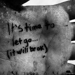 image of hand with writing "it's time to let go..."
